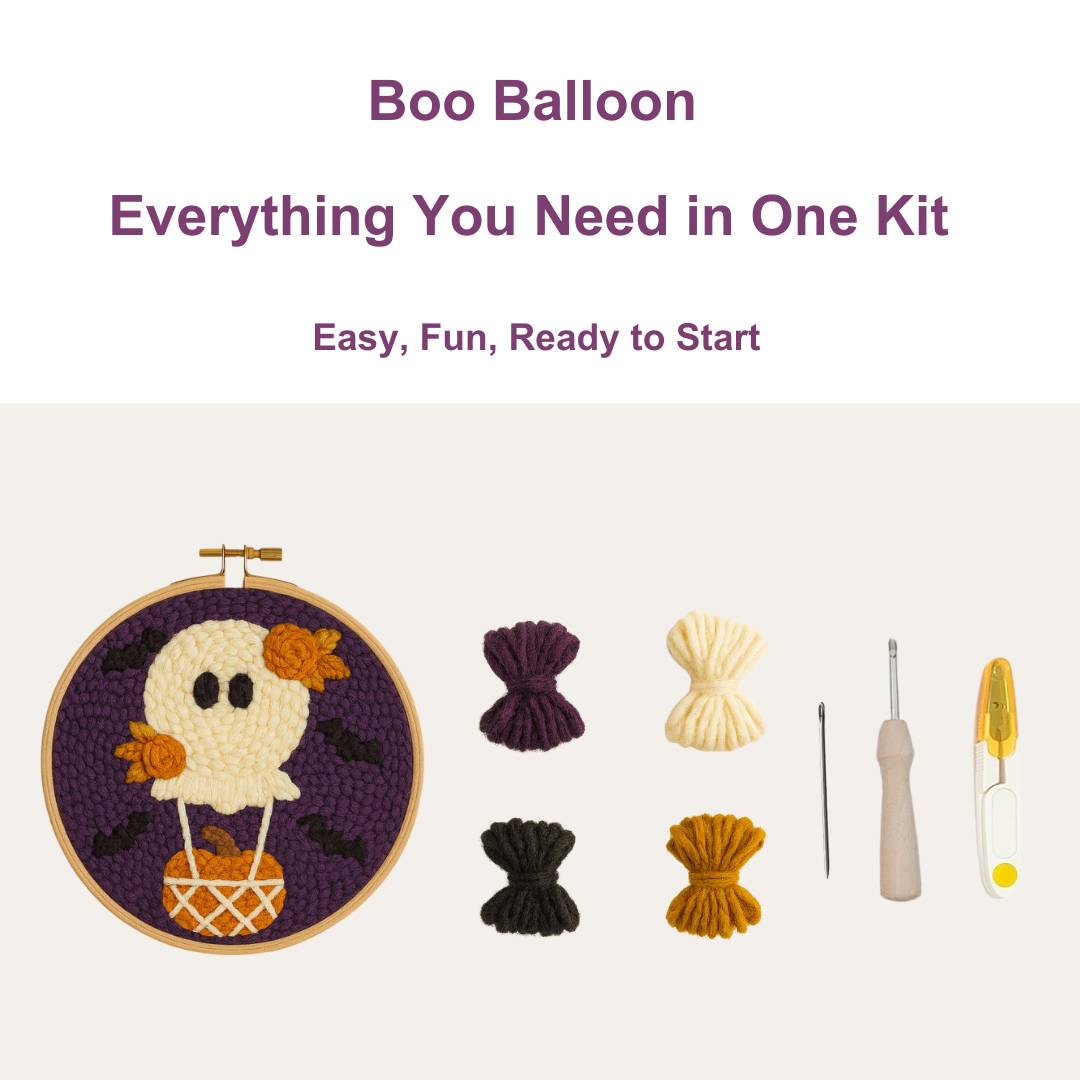 Crochet kit with hoop, yarn, and tools on a white background