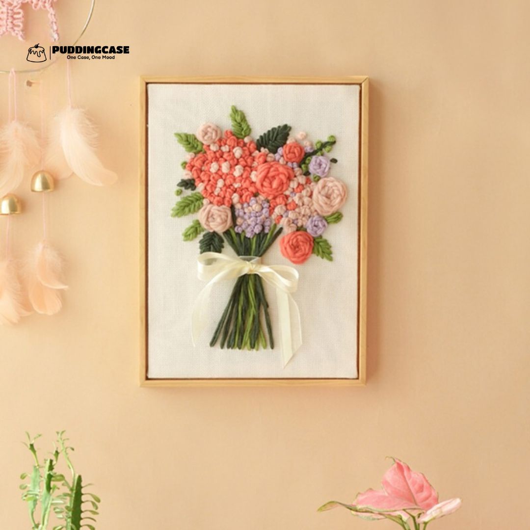 Puddingcase punch needle kit featuring a framed floral bouquet design, beautifully displayed as wall decor, perfect for DIY embroidery enthusiasts and elegant home accents.