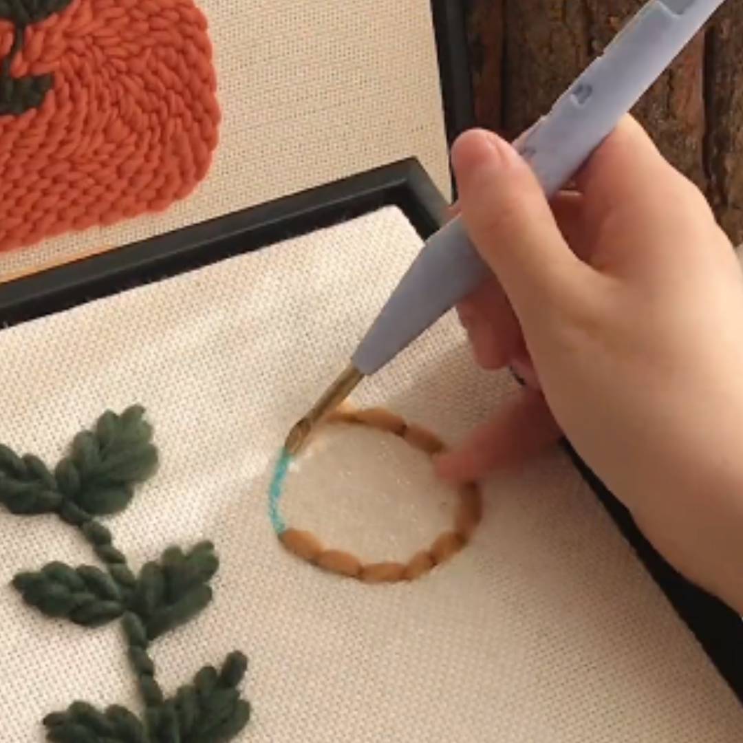 How do you solve the problem of yarn slipping when you make punch needle embroidery art?