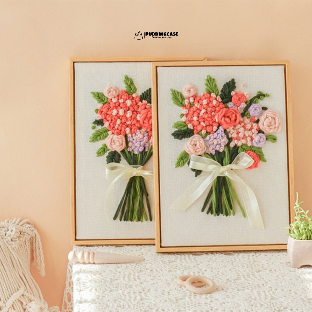  Puddingcase punch needle kit showcasing two vibrant floral bouquet designs with lush greenery and ribbon accents, perfect for DIY embroidery and home decor.