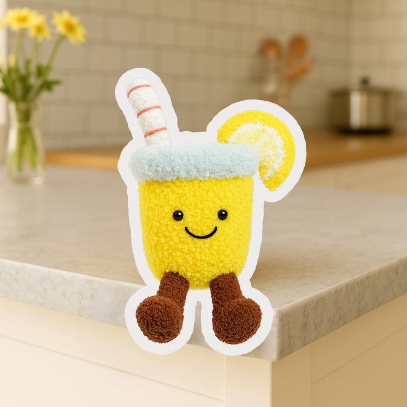 Finished lemon water crochet plushie from Puddingcase, featuring smiling yellow cup with straw and lemon slice